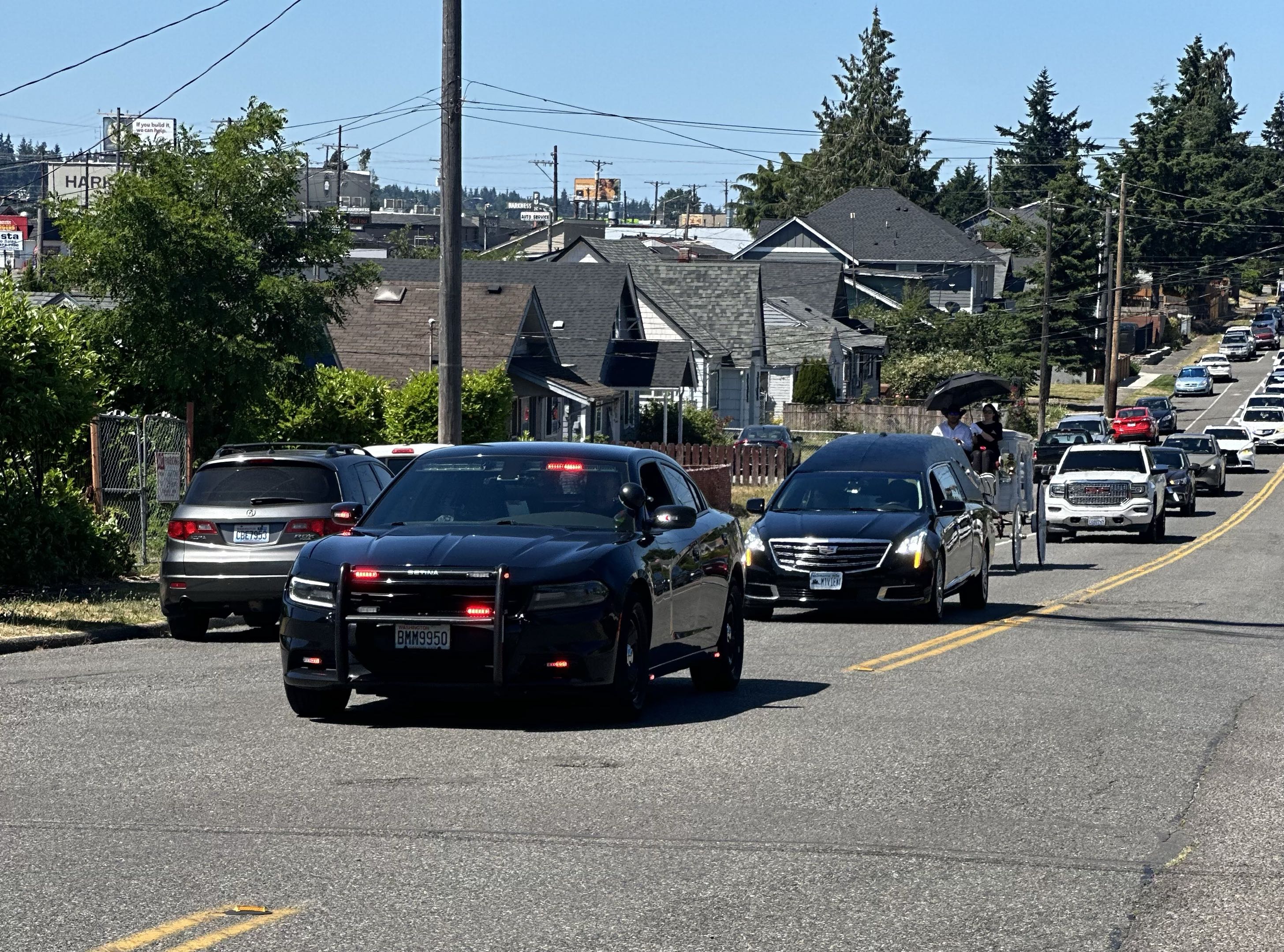 Escort riders holding an intersection for a procession